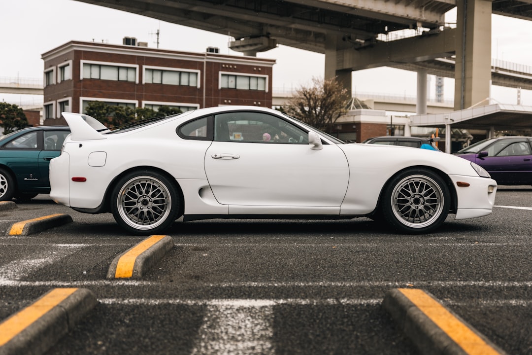 White sports car parked in a lot